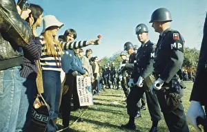 Lcgr1511 Prints: Female demonstrator offers a flower to military police during the 1967 March on the Pentagon