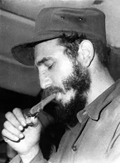 Dictator Prints: FIDEL CASTRO, lighting a cigar, 1967. Courtesy: CSU Archives / Everett Collection