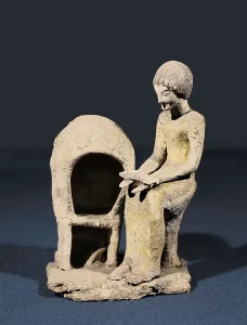 Figure of Woman next to an Oven. ca. 1550 BC - 1100 BC. Mycenaean art. Terra-cotta. FRANCE. Strasbourg. Archaeological Museum. Proc: GREECE. Mycenae