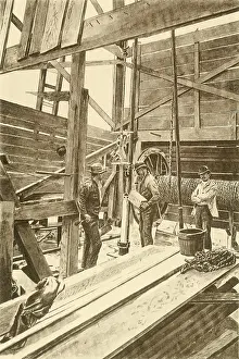 Wells Prints: Filling the torpedo shell prior to shooting the oil well