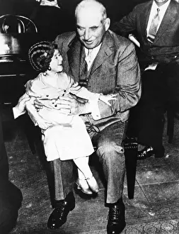 Business Suit Prints: Financier J.P. Morgan with circus midget Lya Graf sitting on his knee, June 1, 1933