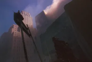 Fireman Prints: Fire fighter at base of burning WTC 6 following the North Tower (WTC 1) collapse