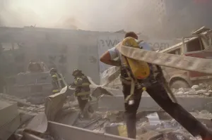 Skyscraper Prints: Fire fighters hauling a hose through rubble on September 11th