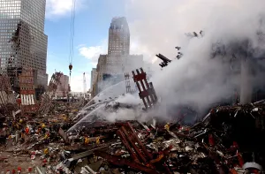 Plane Prints: Firefighters douse the still burning pile of ruins of the World Trade Center two days after the 9/11 terrorists attacks