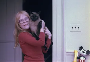 Mickey Mouse Prints: First daughter Amy Carter with her Siamese cat Misty Malarky Ying Yang. Ca. 1978