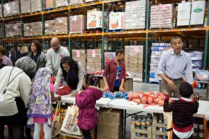 Holiday Prints: The First Family works at a service project at the Capital Area Food Bank in Washington