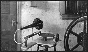 Phonograph Prints: One of the first gramophones set next to a large mechanical wheel, by Emile Berliner, 1888