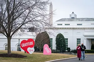 Holiday Prints: First Lady Jill Biden and President Joe Biden enjoy Valentine's Day artwork on the North Lawn of the White House
