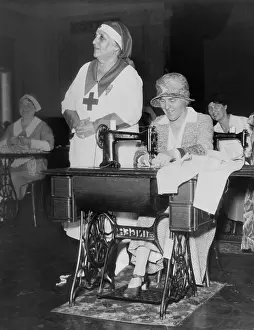 Sewing Machine Prints: First Lady Lou Hoover uses a sewing machine at Red Cross Headquarters in Washington