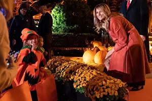 Halloween Prints: First Lady Melania Trump poses for a photo with a trick-or-treater during the 2020 White House Halloween celebration