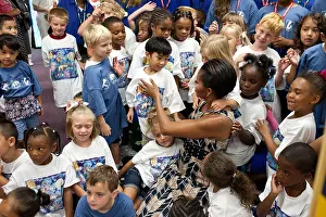Ladies Prints: First Lady Michelle Obama greets children at Naval Air Station Oceana Summer Camp