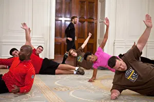 Exercise Prints: First Lady Michelle Obama participates in a taping for the Biggest Loser TV show in the East Room