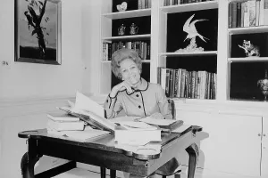 First Ladies Prints: First Lady Pat Nixon working at a small desk in the White House. Ca. 1969-74