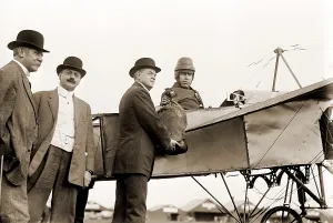 Hitchcock Prints: The first U.S. air mail pouch is handed to helmeted pilot Earle Ovington by Postmaster General Frank H