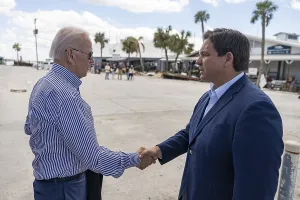 Greeting Prints: Florida Gov. Ron DeSantis greets President Joe Biden as he