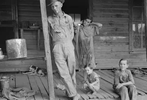 Floyd Burroughs, Alabama sharecropper, on his porch with neighbors children, 1936. By Walker Evans. (BSLOC_2013_7_33)