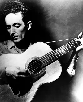 Singer Prints: Folk singer Woody Guthrie, ca.1950s. Courtesy CSU Archives/Everett Collection