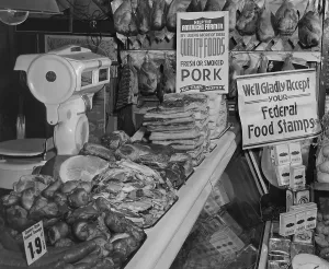 Pigs Prints: Food Market display welcoming Food Stamps made available to Americans on relief from 1939 to 1943
