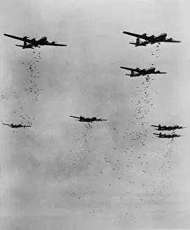 Air Force Prints: Formation of B-29's releasing incendiary bombs over Japan in June 1945