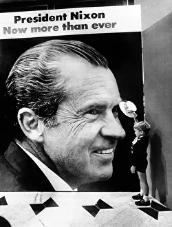 Surreal Prints: A four-year-old boy, tips his hat to a huge poster of President Nixon at the Fountainbleau Hotel