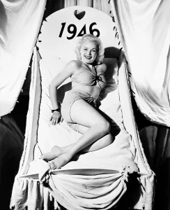 Bathing Suit Prints: Fox starlet June Haver, wishing her fans a happy 1946