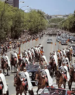 Francisco Franco going for a drive through the Paseo de la Castellana in Madrid after presiding the Parade of the Victory. He is with the Minister of the Army, Juan Castaon