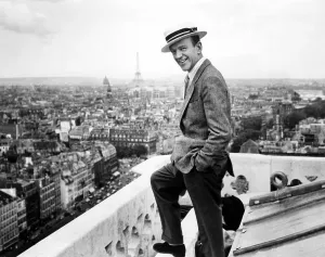 Images Dated 20th April 2005: Fred Astaire takes a break from filming FUNNY FACE to enjoy the Parisian skyline