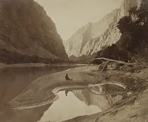 1870s Prints: Frederick Samuel Dellenbaugh relaxing on sandbank during John Wesley Powell's second expedition down the Colorado