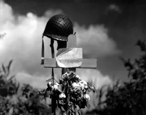 Liberation Prints: French civilians tribute to an American soldier who died during the fighting in Carentan