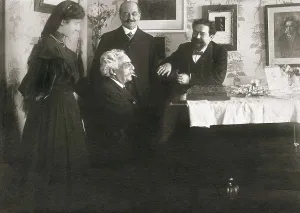 French composer Gabriel Faur (by the piano) with Spanish composer Isaac Albniz (right). With them, Clara Sansoni, Albniz's pupil and her father