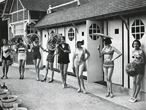 Polka Dots Prints: French women pose in the latest fashionable bathing suits outside their beach cabanas at Dieppe