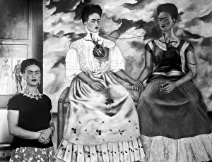 Story Frida Prints: Frida Kahlo shown with her painting Me Twice