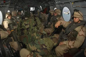 Candid Occupational Portrait Prints: Fully geared U.S. Marines in helicopter about to be deployed in Afghanistan from the amphibious command ship USS Bataan