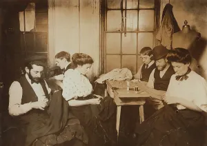 Sewing Prints: Garment workers sewing by hand in a small New York City sweatshop in1908