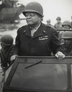 Jeep Prints: Gen. Benjamin O. Davis watches a Signal Corps crew erecting poles