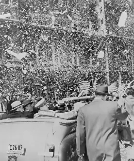 Broadway Prints: Gen. Douglas MacArthur sitting in the rear of an open car riding up Broadway during a ticker tape parade