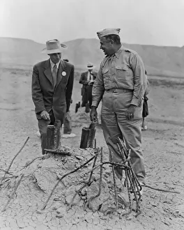 Testing Prints: Gen. Leslie Groves (r) and Dr. J. Robert Oppenheimer at Trinity Test Site in Sept. 1945