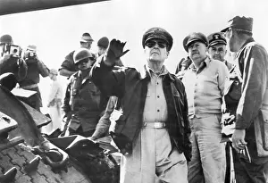 Korea Prints: General Douglas MacArthur inspecting troops in the company of other officers and photographers