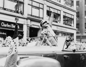 Open Car Prints: General Dwight Eisenhower waves to cheering New York crowds. June 19, 1945