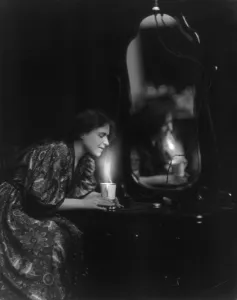 Consumer Products Prints: General Electric advertising photo of woman at dresser heating a cup of water with a General Electric appliance