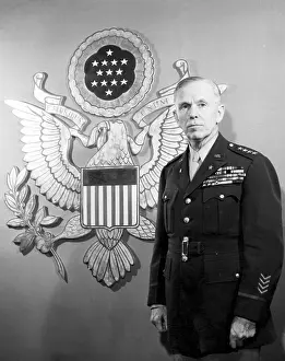 General Prints: General George C. Marshall standing in front of an enlarged Ofiicers Insignia