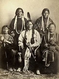 Four generations of Sitting Bulls family at Fort Randall in 1882. The warrior chief sits with a sister, two wives, a daughter, her daughter, and her baby