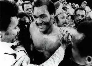 Heavyweight Champ Prints: GEORGE FOREMAN- The boxer is congratulated in the ring after defeating Joe Frazier for the world heavyweight