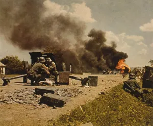 Tanks Prints: German anti-tank gun team on road with a flaming tank in background