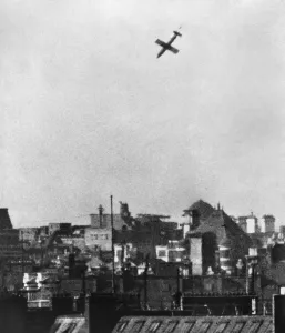 Aerial Bombing Prints: German Robot plane, V-1 Buzz bomb drops over a city in southern England