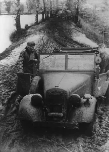 Lcgr1310 Prints: German soldier and officer pushing their car through Russian mud