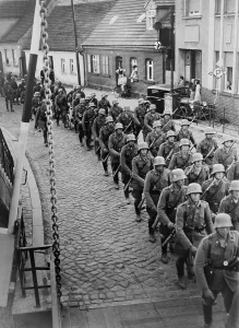 War 2 Prints: German soldiers marching through the town of Storkow