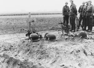 Memorial Prints: German Waffen-SS troops at the helmet topped graves of their fellows during the invasion of Poland