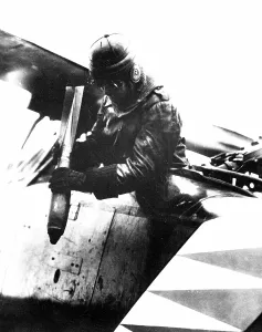 Bombers Prints: German World War I aviator dropping a bomb somewhere on the western front. 1914-1918