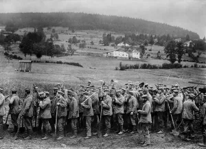 Forced Labor Prints: German WW1 POWs returning from work armed with only shovels. 1914-18. (BSLOC_2012_4_181)